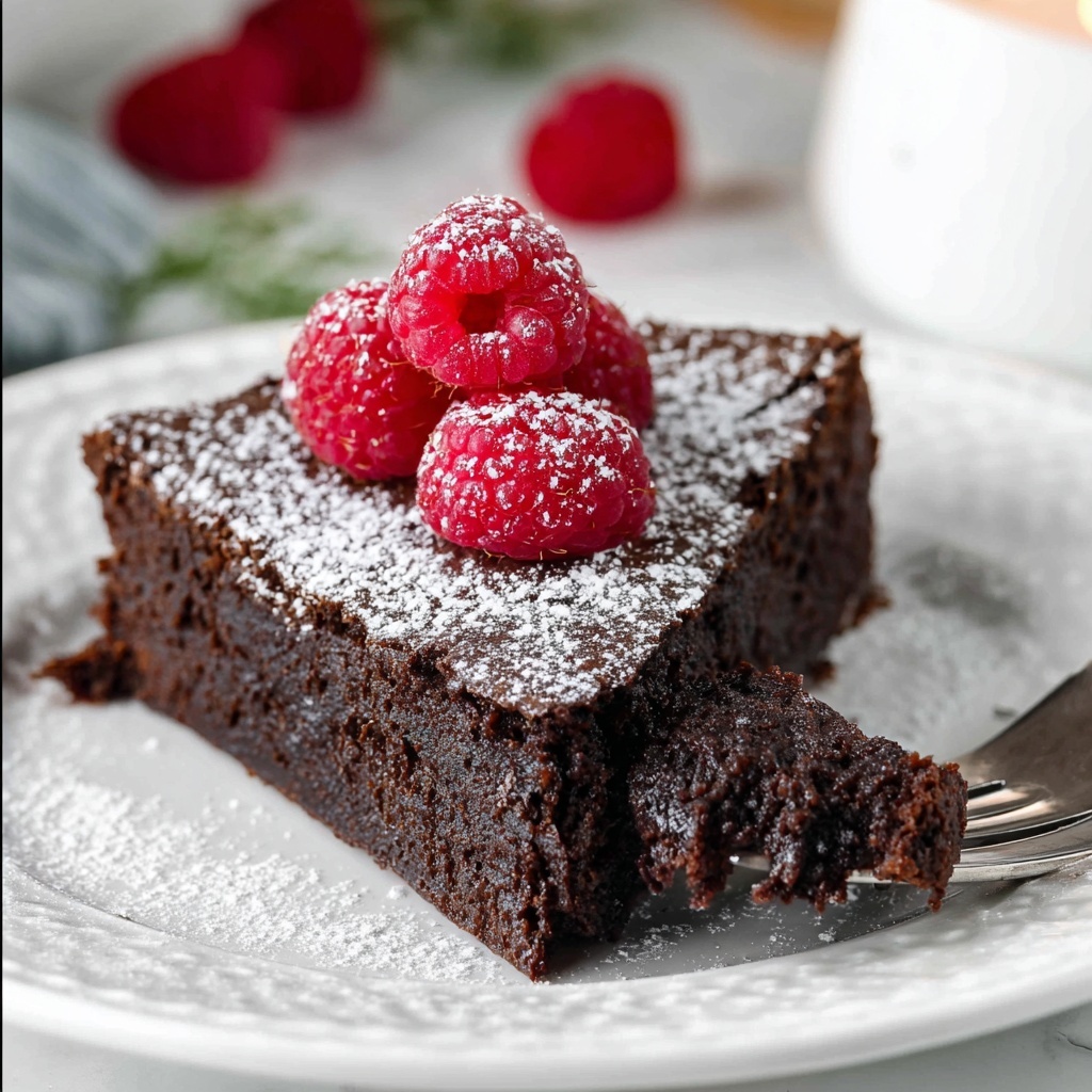 Flourless Chocolate Cake with Raspberries and Powdered Sugar Recipe - Recipe Image
