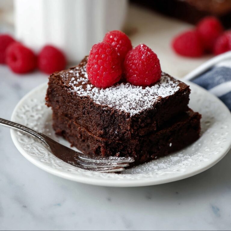 Flourless Chocolate Cake with Raspberries and Powdered Sugar Recipe